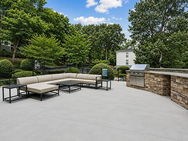Entertain in style with our modern outdoor kitchen and stone grills surrounded by beautiful landscaping.