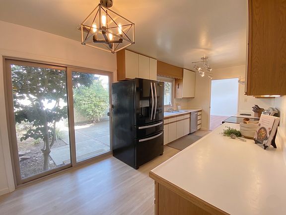 Newly renovated kitchen floor that comes with dishwasher and refrigerator