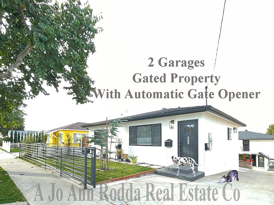 Front of house. The driveway gate opens and closes with remotes.