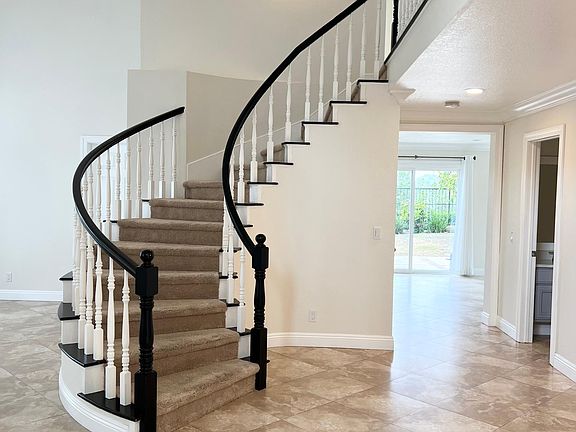Grand entrance with a curved staircase