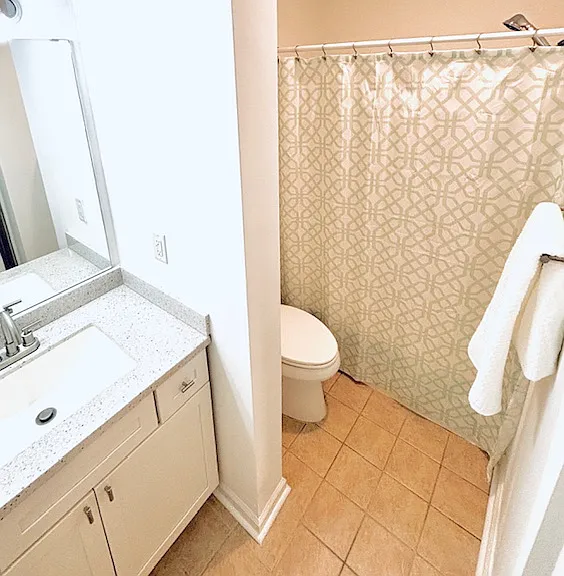 Second full bathroom with shower over tub