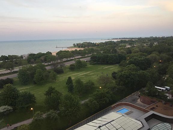 view of lake and park from the living room