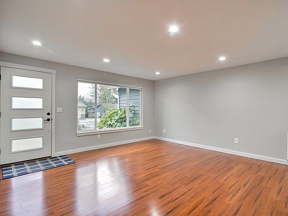 Entry to main living room with shades include