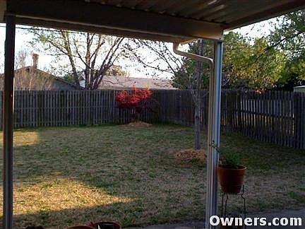 lovely back yard with covered patio, fenced