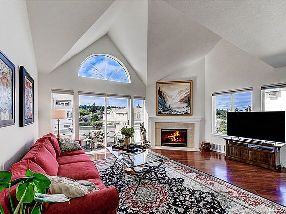Open floor plan, vaulted ceiling in living room. Lots of windows, sunlight all day.