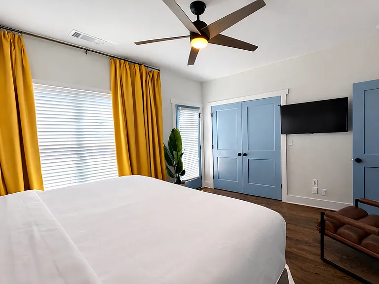 Located on the 2nd floor, the Beltline Suite features plush bedding and luxe linens, bedside charging, blackout curtains, dresser, a ceiling fan, Smart TV, bathroom and deck, all wrapped in thoughtfully curated designer interiors for a stylish stay.