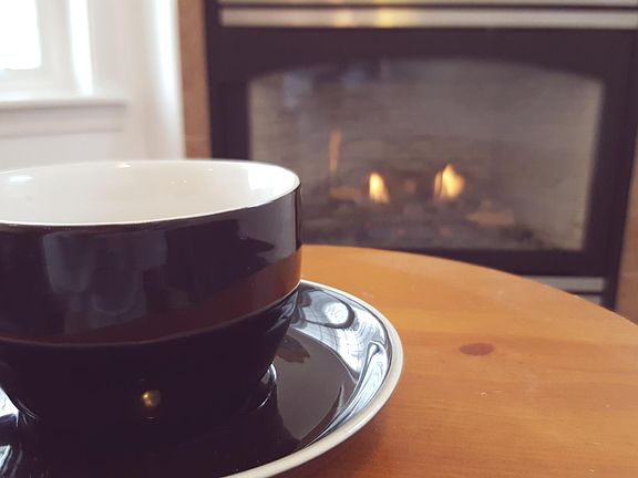 Coffee by the fireplace