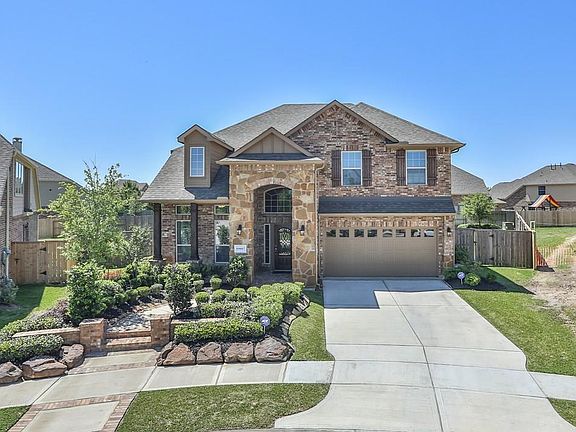 This home has gorgeous curb appeal with the stone arched entry!