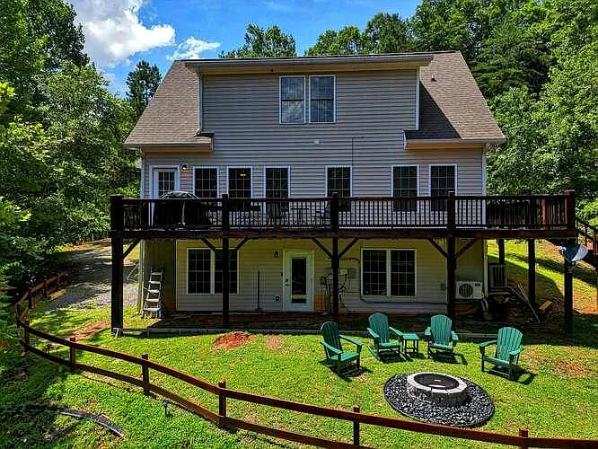 Rear of home facing water. Taken before outdoor awning was installed. - 2615 Rolling River Dr