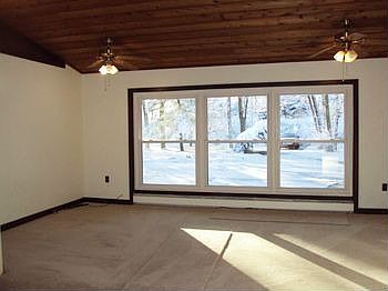 This sun roomoffice has a wood ceiling and new carpeting in 2011.