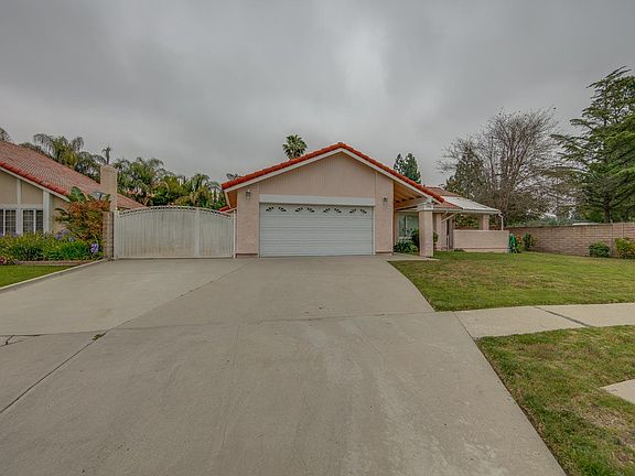 Gated RV. Two car attached garage with direct access into house, plus a side door to the RV and rear yard.