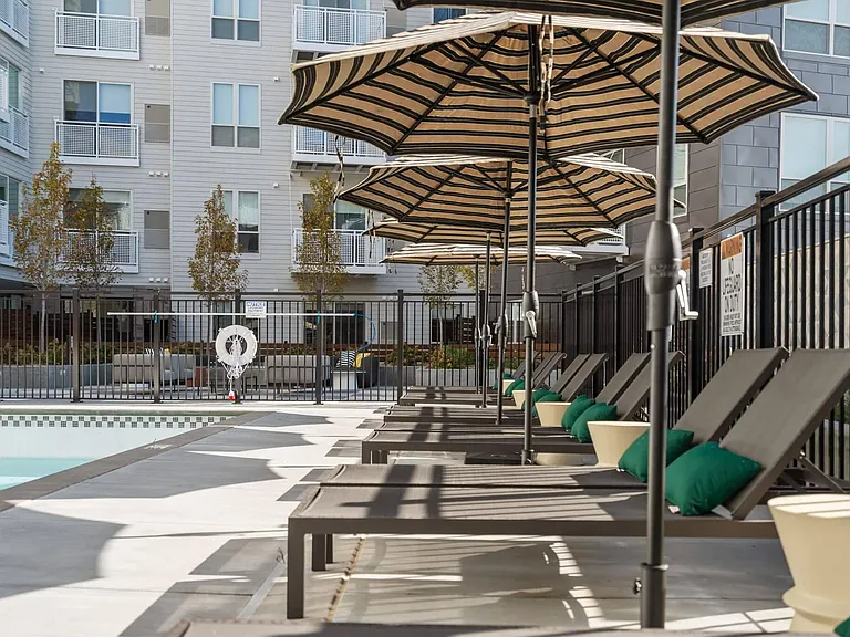 Relax by the pool on our rooftop amenity deck at The Hallon Luxury Apartments in Hopkins MN