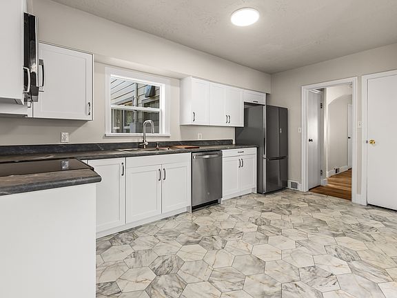 BRAND NEW KITCHEN - new flooring, paint, lighting, cabinets, appliances and countertops.