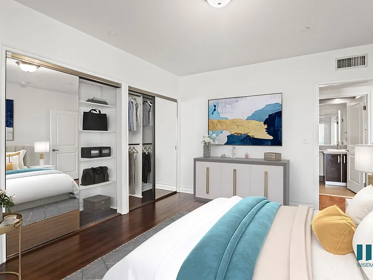 Bedroom with Two-Mirrored Closets, Vinyl Flooring, and Bathroom