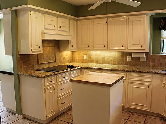 Under cabinet lighting and plenty of cabinet space.