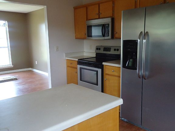 View of the kitchen and adjoining dining room.