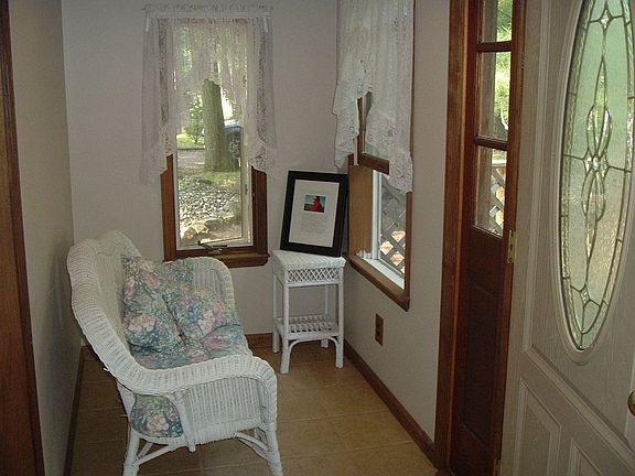 Front Enclosed Porch great to sit & relax, have  a cup of tea or coffee & read
