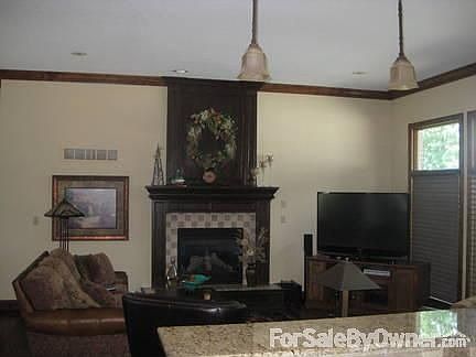 Great room : Gas fireplace and dark wood brings out the warmth of the great room