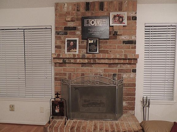 Real wood burning brick fireplace .....