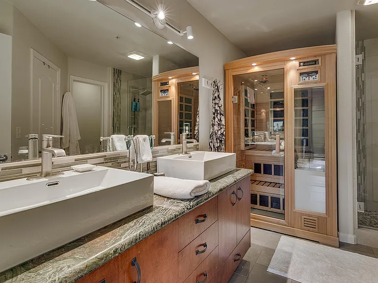 luxurious bathroom with sauna and walk in shower
