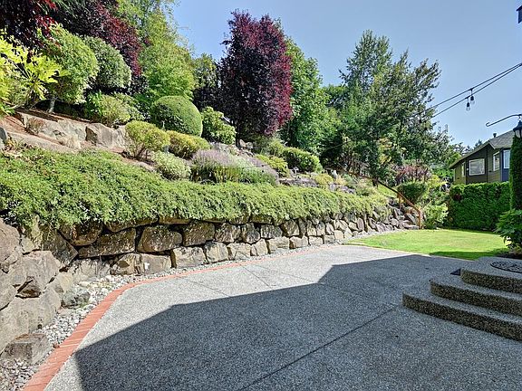 Back yard is so pretty and private. Yard work provided by seller