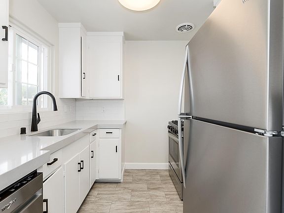 Remodeled kitchen with all new stainless steel appliances and quartz counter tops