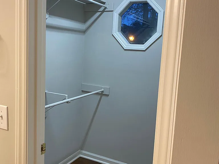 Walk-in closet in main bedroom. Shelving not pictured.