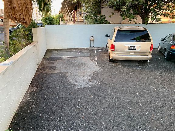 Corner open parking stall 20'-30' away from the front door.