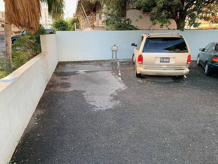 Corner open parking stall 20'-30' away from the front door.