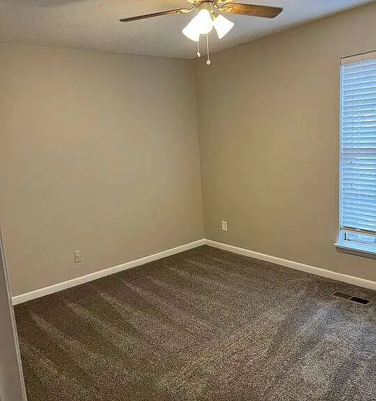 Transform your lifestyle at Arbor Terrace. This spacious living area features stylish carpeting and ample natural light, perfect for creating your personal sanctuary. Explore the possibilities in your new home today!