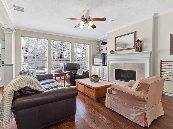 Large windows let natural light stream into the main level family area.