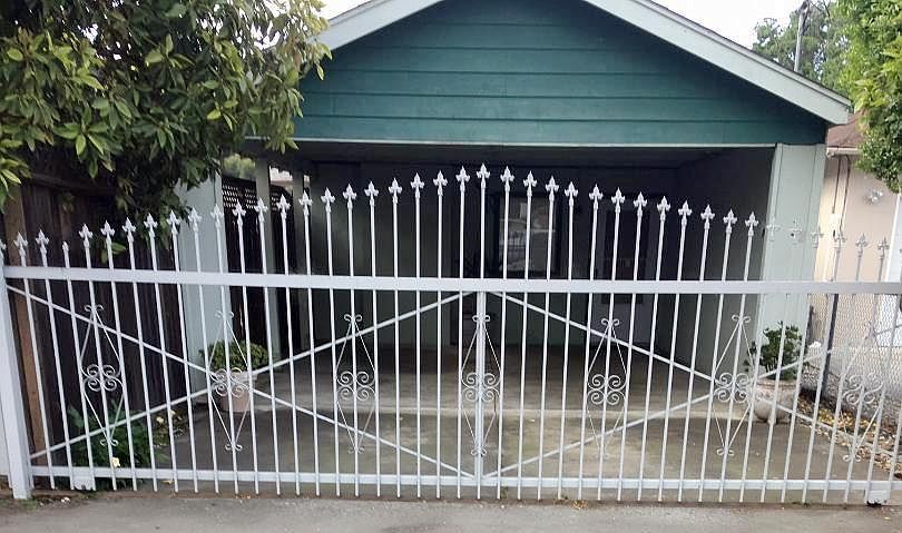 Covered 2Cars Carport And Wrought Iron Gate Entrance On Runnymede Street.