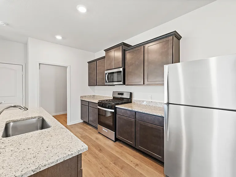 The kitchen of the Camelia has a gorgeous wood cabinetry.