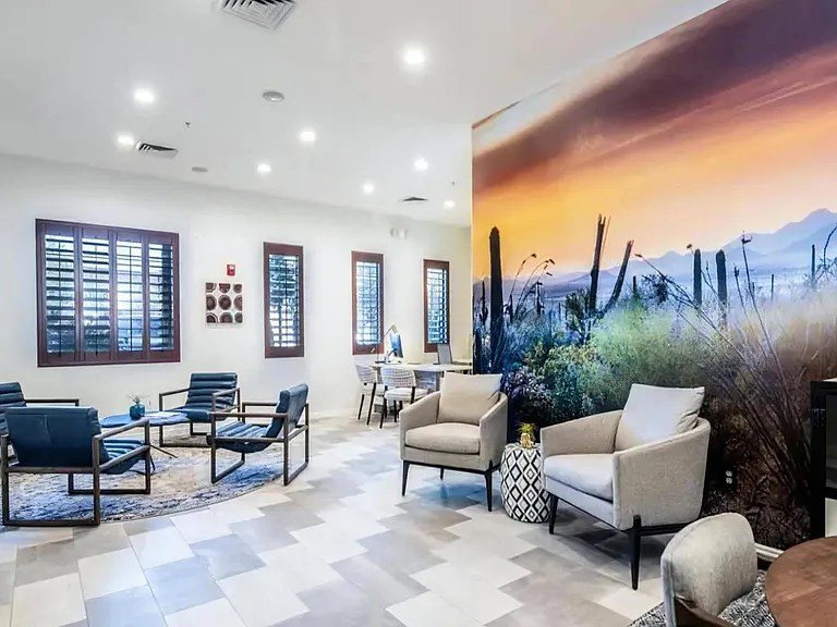 Community Lounge and Leasing Office with Comfortable Seating and Computer Workstations