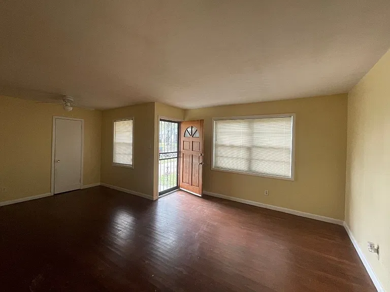 Perfect size living room with hardwood floors .