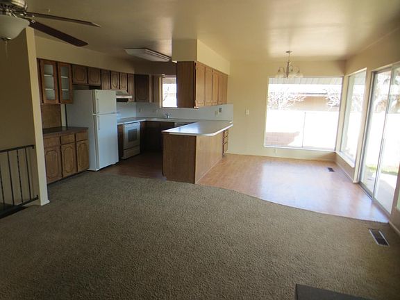Kitchen and dining area - adjacent to great room, dining room and entry.