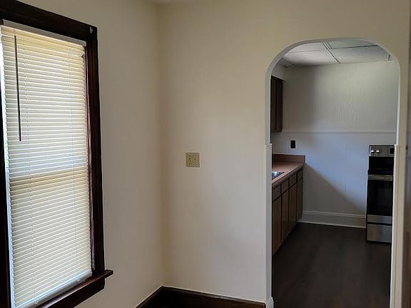 Breakfast nook leading to kitchen with new windows.