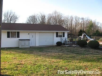 Front of house with view of carport