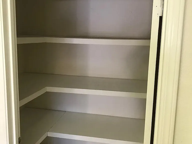 A large pantry to store all your food essentials, can goods, extra kitchen appliances next to the kitchen.