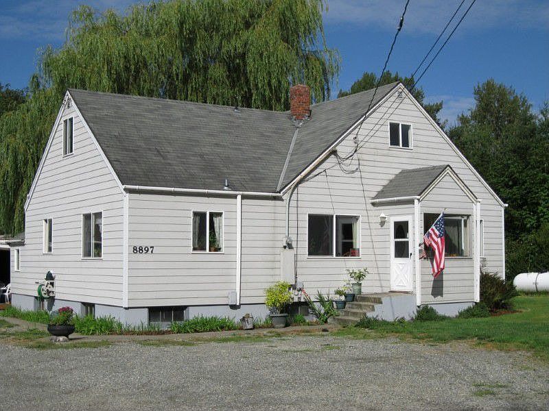 House sits well back from the road and has ample parking for family and guests.