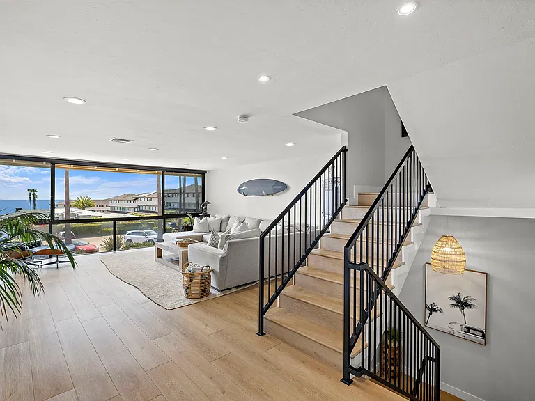 LIVING ROOM/STAIRS LEADING UPSTAIRS TO 2 BEDROOMS