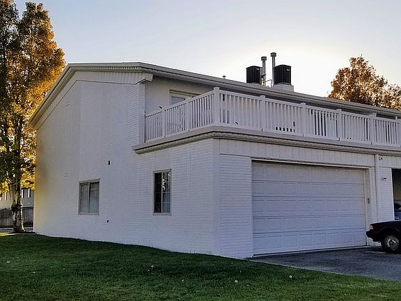 Back view, garage & deck