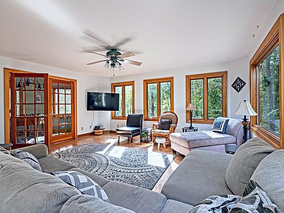 Living room, doors into game room, and Roku TV.