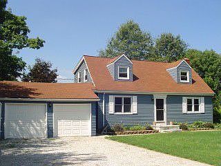 Very private Cape Cod with many updates, horse barn and pond!