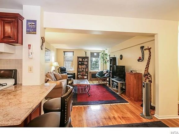 Come on in. As you can see, your spacious living room is straight ahead with beautiful hardwood floors.