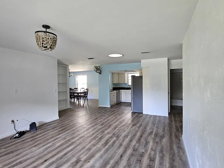 Open floor plan looking from living room towards kitchen and dining room.