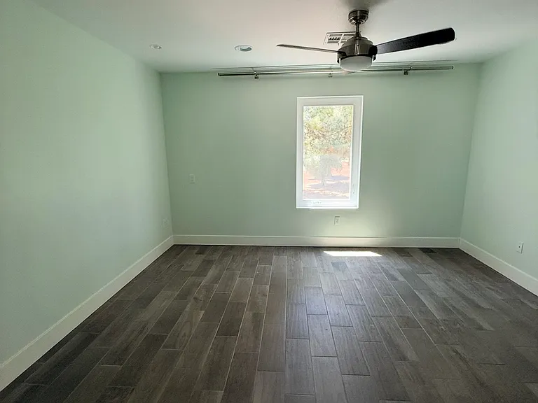 Master bedroom with a golfcourse view.