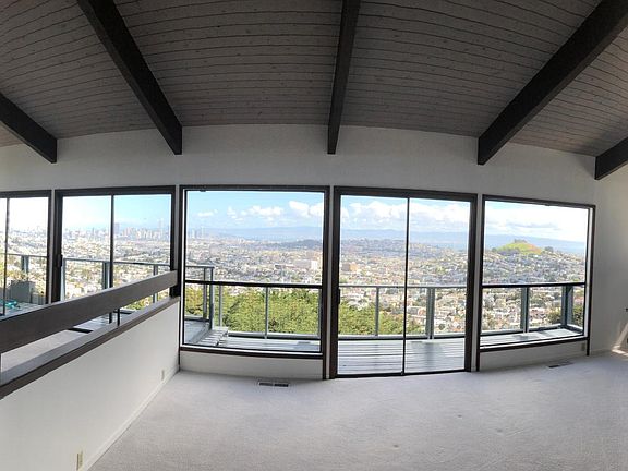 living room and dining room with panoramic view of the city