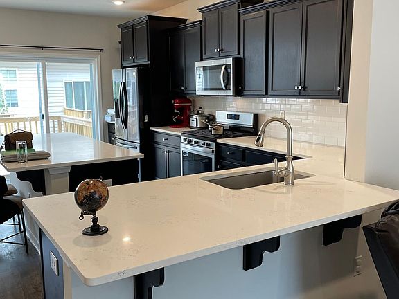 kitchen with quartz countertops large center island