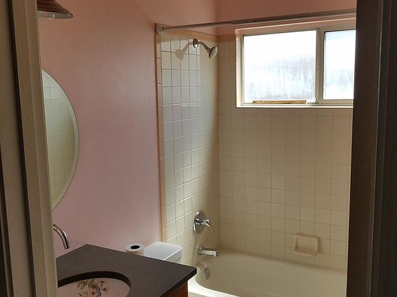 Second bathroom with custom ceramic sink.